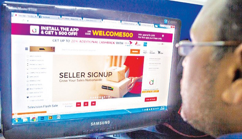 A file photo shows a man browsing an e-commerce site on a computer in Dhaka. The government has opened up the submarine cable licensing regime for private companies in apprehension that the country may fall into bandwidth scarcity by the year 2024 when the country’s demand would reach 6 terabyte per second. — New Age photo
