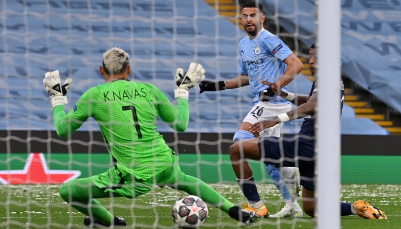 Manchester City midfielder Riyad Mahrez (C) scores his team’s opening goal against Paris Saint-Germain during their UEFA Champions League semi-final second leg match at the Etihad Stadium on Tuesday. — AFP photo