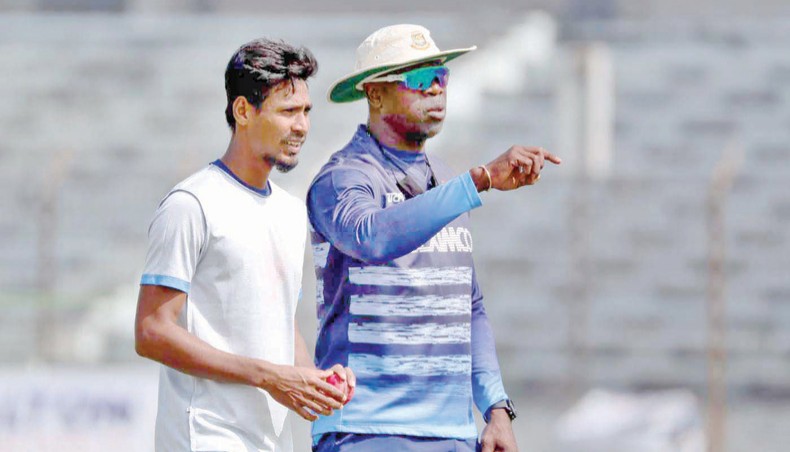 A file photo shows Bangladesh pace bowling coach Ottis Gibson (R) giving some tips to pacer Mustafizur Rahman during a training session at the Sher-e-Bangla National Stadium. — BCB photo
