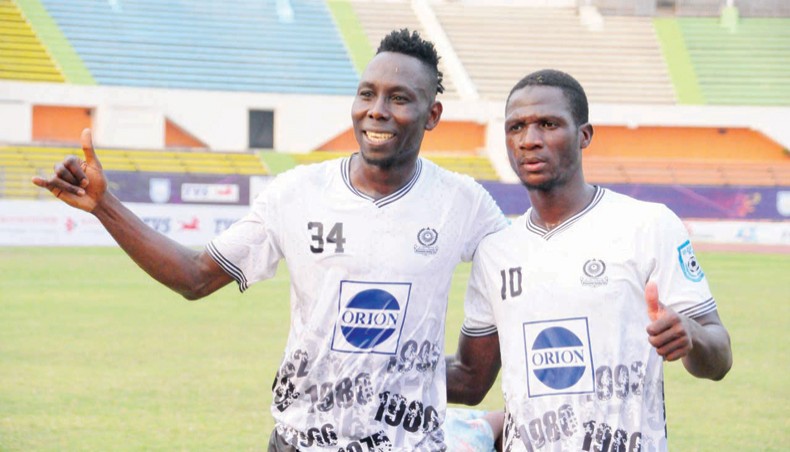 Mohammedan Sporting Club’s Cameroonian forward Yassan Ouatching (L) and Malian forward Souleymane Diabate show victory sign at the end of their BPL match against Saif SC at the BNS on Wednesday. — BFF photo