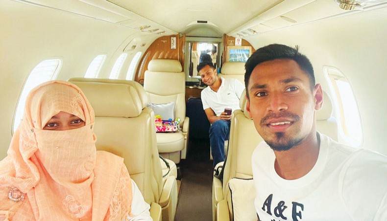 Bangladesh pacer Mustafizur Rahman, his wife Samia and all-rounder Shakib Al Hasan are seen inside a chartered flight during their returning home from India on Thursday. — Twitter photo