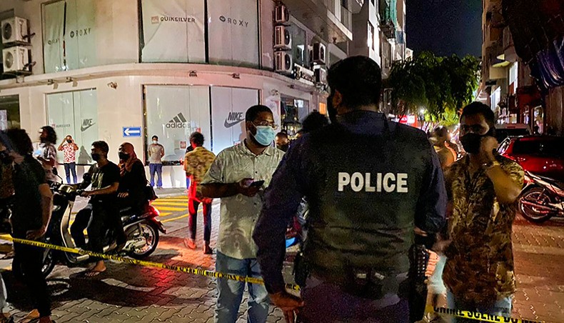 Police secure a site after a suspected bomb blast injured former Maldives president and current parliament speaker Mohamed Nasheed in Male on Thursday. — AFP photo