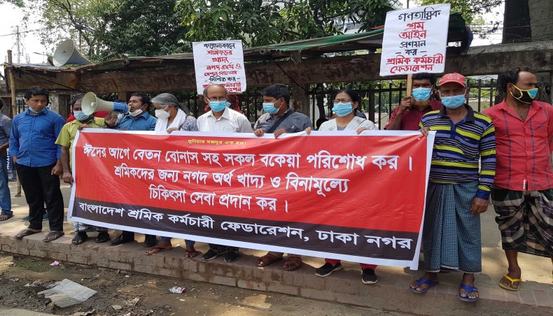Bangladesh Sramik Karmachari Federation holds a rally in front of the National Press Club in Dhaka on Friday. --- New Age Photo