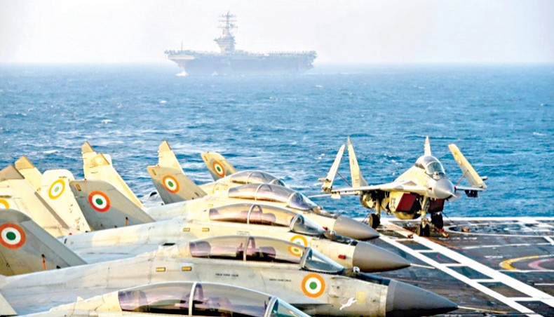 The handout photo shows Indian army fighter jets on the deck of an aircraft carrier during the second phase of the Malabar naval exercise in the Arabian sea. — Al Jazeera/Agence France-Presse/Indian Navy