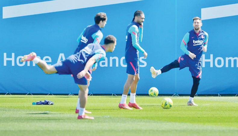 Barcelona captain Lionel Messi (R) attends a training session at the Joan Gamper Sports City training facilities in Sant Joan Despi on Friday. — AFP photo