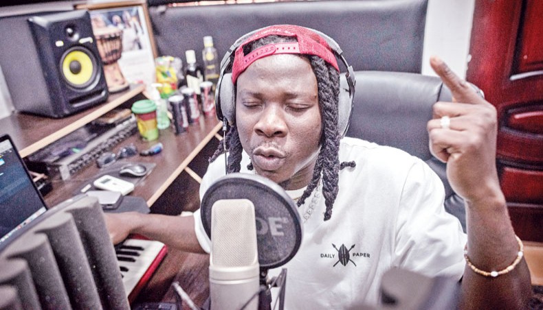 Ghana Afropop musician, Stonebwoy, sings during a recording session at his studio in his house in Accra, Ghana, on March 25, 2021. — AFP photo