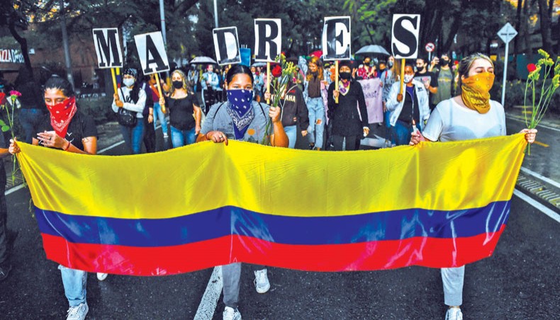Women hold a Colombian flag and the letters forming the word ‘Mothers’ during a protest against president Ivan Duque’s government, in Medellin, Colombia, on Thursday. Colombia’s government on Thursday invited protest leaders to a dialogue in an attempt to calm tensions following more than a week of deadly demonstrations against president Ivan Duque. — AFP photo