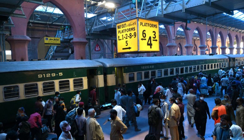 Passengers gather on a railway station as they prepare to board a train to their hometowns during Ramadan ahead of Eid-ul-Fitr festivities in Lahore, Pakistan on Saturday. — AFP photo