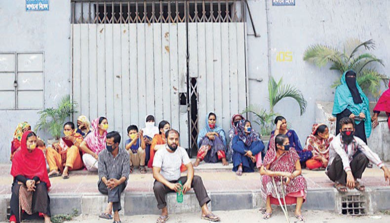 A file photo shows workers protesting against non-payment of wages in front of a readymade garment factory in the capital. Twenty-five per cent of the government stimulus loan-receiving garment factories has cut headcounts in violation of conditions associated with the loans, according to a study conducted by the Centre for Policy Dialogue and the Shojag Coalition Study.— New Age photo