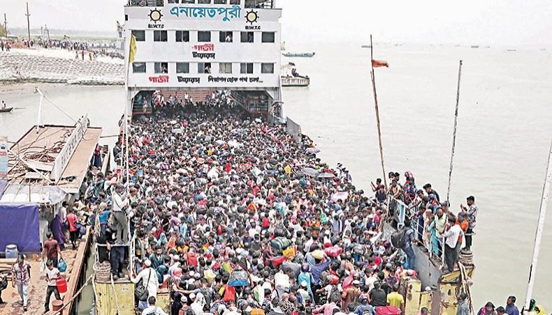 People huddle in a ferry to leave Dhaka before Eid-ul-Fitr. Such a situation raises concern of a more virulent surge in Covid infection in Bangladesh. — New Age/Sony Ramany