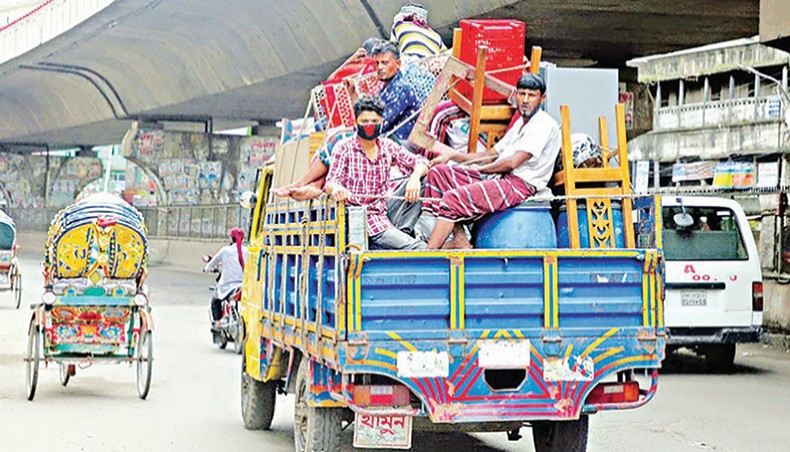 A file photo shows people leaving the capital with their belongings on a truck recently due to income losses amid the coronavirus outbreak in the country. — New Age photo