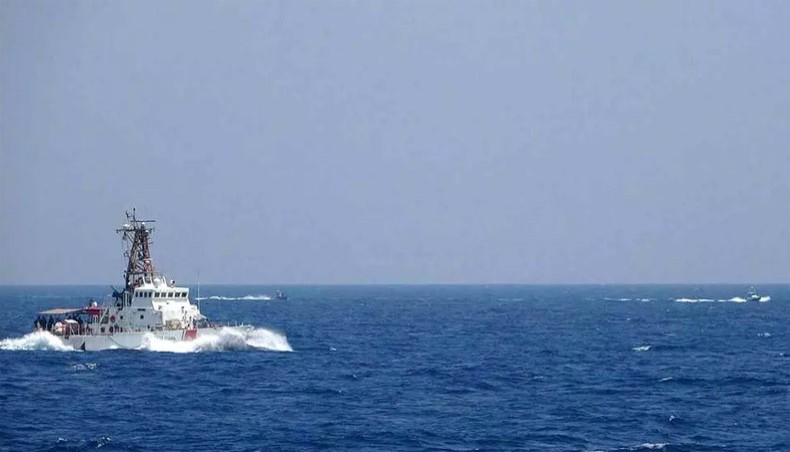 A US Navy photograph from May 10 showing two Iranian attack craft in the distance, which Washington said buzzed US naval vessels in the Strait of Hormuz. --AFP photo