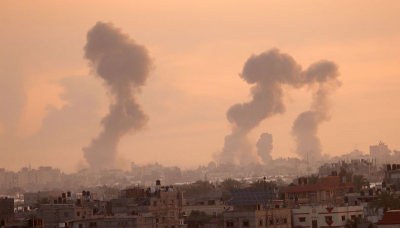 Smoke rises after a series of Israeli airstrikes targeted Khan Yunis in the southern Gaza strip, early on May 12, 2021. — AFP Photo