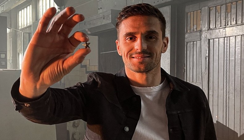 Ajax player Dusan Tadic with a star-shaped souvenirs that will be given to fans.-- Twitter photo