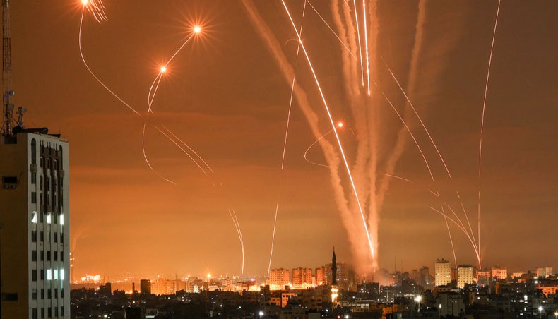 Rockets light up the night sky as they are fired towards Israel from Beit Lahia in the northern Gaza Strip on May 14, 2021. — AFP Photo