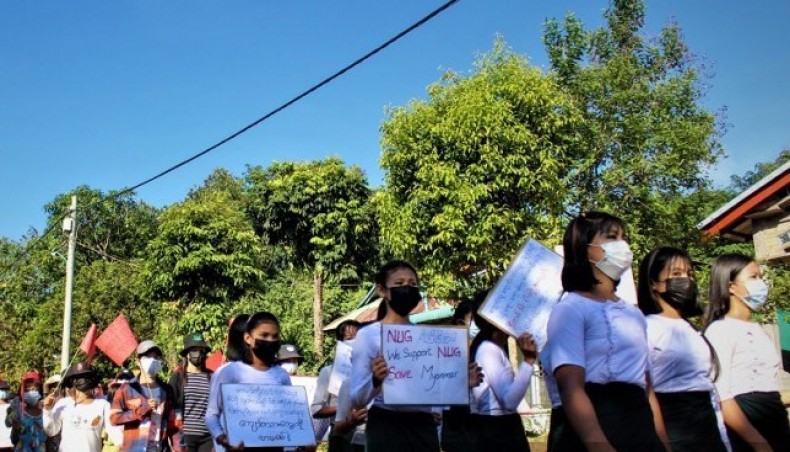 This handout photo taken and released by Dawei Watch on May 15, 2021 shows protesters holding signs during a demonstration against the military coup in Dawei. — AFP photo