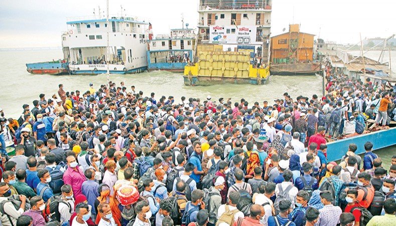 Thousands of people crowd Shimulia Ferry Terminal in Munshiganj on May 9, 2021 even after the ferry services were suspended the day before and BGB personnel were deployed to restrain the people on their way to their village homes ahead of Eid. — Sony Ramany