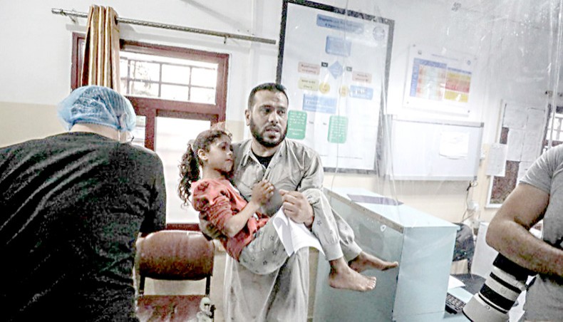 A wounded Palestinian girl is brought to a hospital for medical treatment after Israeli airstrike in the Gaza Strip on May 10 in Beit Lahia, Gaza. —Getty Images/Anadolu Agency/Ali Jadallah