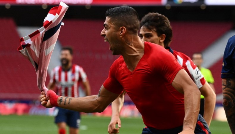 Atletico Madrid forward Luis Suarez celebrates after scoring his team's second goal during their La Liga match against Osasuna at the Wanda Metropolitano Stadium in Madrid on Sunday.-- AFP photo