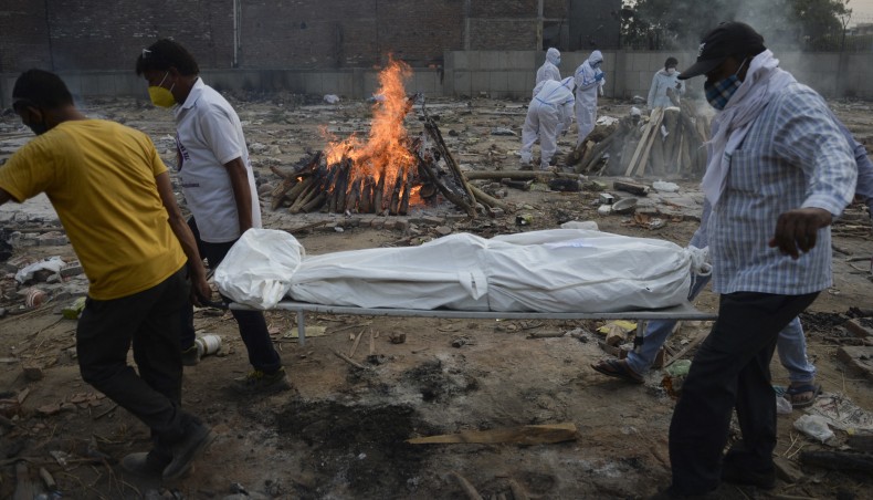 Relatives mourn as they arrive for the cremation of their loved one who died due to the Covid-19, at a crematorium in New Delhi on May 11, 2021. — AFP file photo