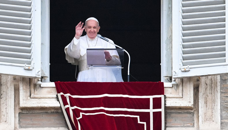 Pope Francis waves from the window of the apostolic palace overlooking St Peter’s Square, during the weekly Angelus prayer followed by the recitation of the Regina Coeli on May 16, 2021 in The Vatican. — AFP photo