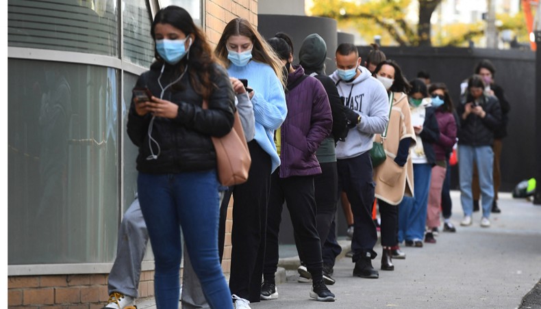 People queue for a Covid-19 test in Melbourne on May 27, 2021 after five million people in Melbourne were ordered into a snap week-long lockdown following another Covid-19 virus outbreak. – AFP Photo.