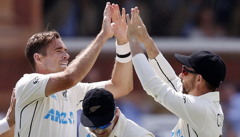 New Zealand's Tim Southee (L) celebrates the wicket of England's Ollie Robinson (unseen) on the fourth day of their first Test at Lord's on Saturday. — AFP photo