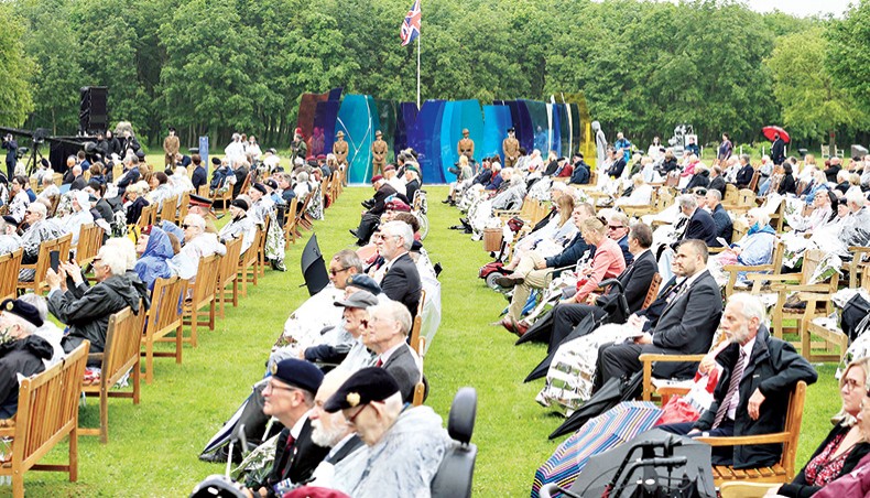 Normandy veterans, their families and friends mark the 77th anniversary of D-Day on Sunday, at the British Normandy Memorial at the National Memorial Arboreum in Alrewas, central England, as they watch the opening of the British Normandy Memorial via live video link from Normandy in France. — AFP photo