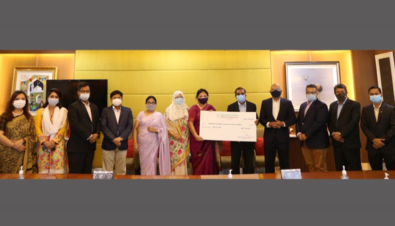 The Mutual Trust Bank Foundation authorities hand over a cheque to Society for the Welfare of Autistic Children at the MTB corporate office in Dhaka recently. — Press Release