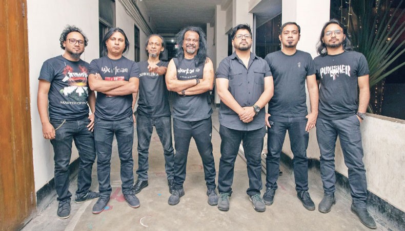 Sheikh Monirul Alam Tipu, fourth from left, along with members of Warfaze poses for a photo.