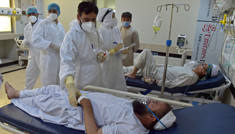 In this photograph taken on June 8, 2021, medical personnel treat Covid-19 patients at the intensive care unit of the Muhammed Ali Jinnah hospital in Kabul. — AFP photo