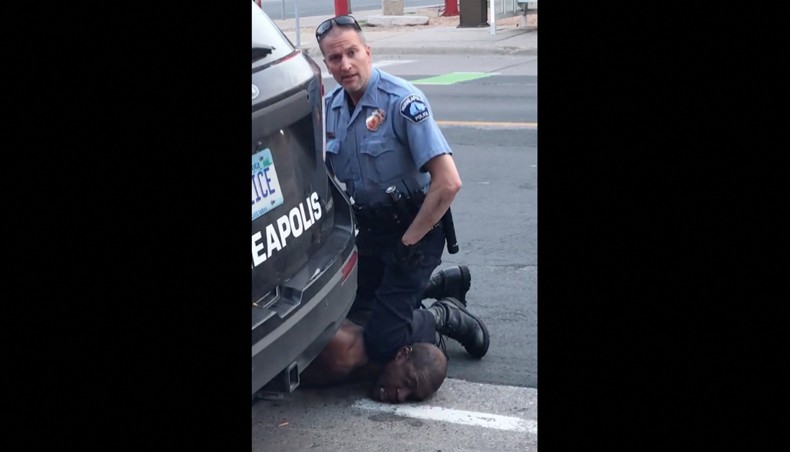This still image taken from a May 25, 2020, video courtesy of Darnella Frazier via Facebook, shows Minneapolis, Minnesota, police officer Derek Chauvin arresting George Floyd. The Pulitzer Prize Board awarded a ‘special citation’ on June 11, 2021, to Darnella Frazer, whose video of the murder of George Floyd by a police officer, sparked worldwide protests against racial injustice. Frazer was honored at a ceremony announcing the 2021 prestigious journalism awards for her