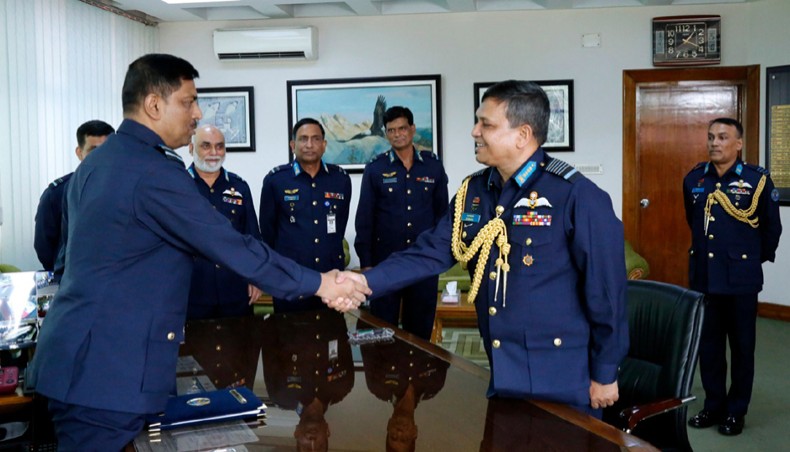 Newly appointed Chief of Air Staff Air Vice Marshal Shaikh Abdul Hannan exchanges greetings with outgoing Chief of Air Staff Air Chief Marshal Masihuzzaman Serniabat at a ceremony at Chief of Air Staff’s secretariat in Dhaka on Saturday. – ISPR photo