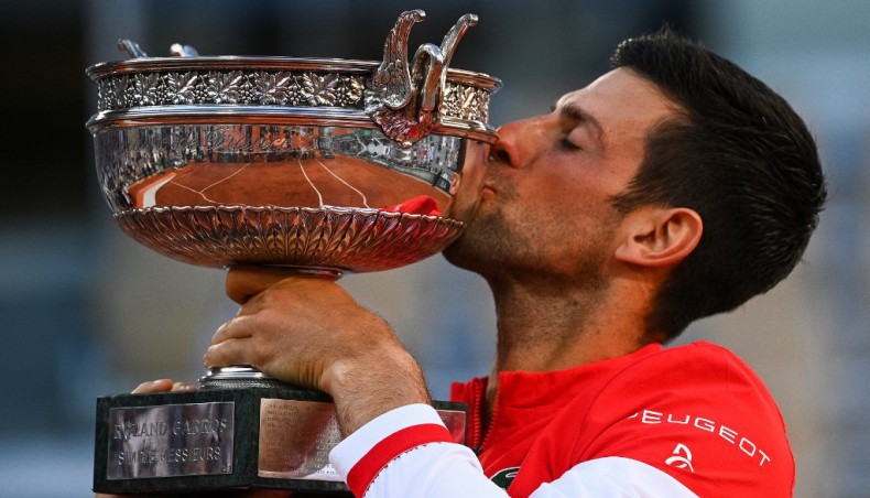 Serbia's Novak Djokovic kisses the trophy after defeating Greece's Stefanos Tsitsipas in the French Open men’s singles final in Paris on Sunday. — AFP photo