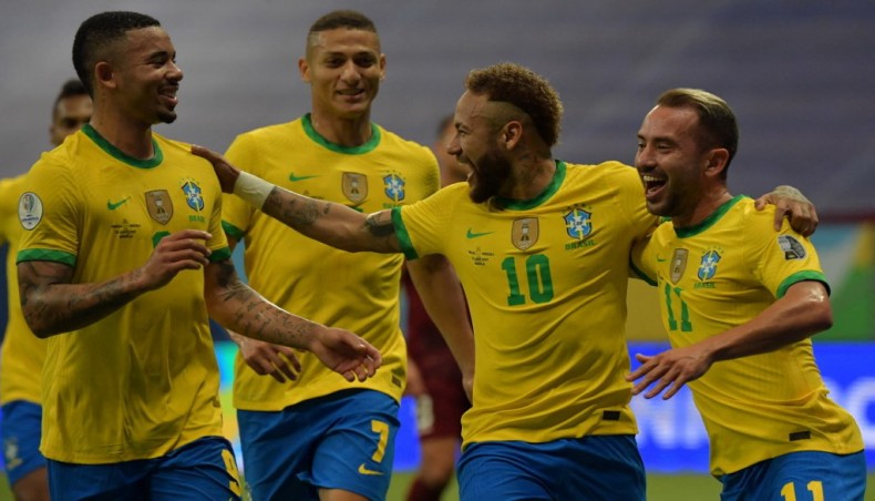 Brazilian forward Neymar (2nd-R) celebrates with teammates after scoring against Venezuela during the Copa America match at the Mane Garrincha Stadium in Brasilia on Sunday. — AFP photo
