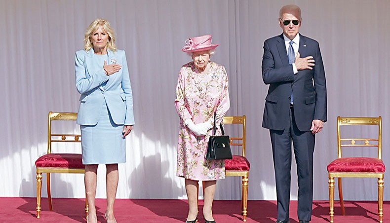 US president Joe Biden, right, and US First Lady Jill Biden, left, stand beside Britain’s Queen Elizabeth II as a Guard of Honour formed of The Queen’s Company First Battalion Grenadier Guards give a Royal Salute during the US National Athem at Windsor Castle in Windsor, west of London, on Sunday. — AFP photo