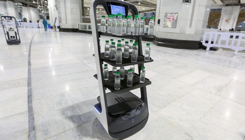 A picture taken on June 15, 2021, shows a smart robot used for the first time at the Grand Mosque in Saudi Arabia's holy city of Makkah, supplying worshippers with bottles of Zamzam water to reduce direct contact with staff as a measure to prevent COVID-19 infections during the yearly hajj pilgrimage. – AFP photo