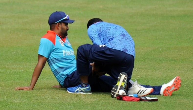 Prime Bank Cricket Club captain Tamim Iqbal gets some treatment from the medical staff during their Dhaka Premier League match against Khelaghar Samaj Kallyan Samity at Mirpur on Thursday. — Courtesy photo
