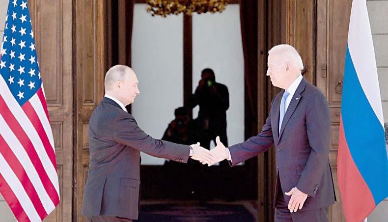 Russian president Vladimir Putin, left, shakes hands with US president Joe Biden prior to the US-Russia summit at the Villa La Grange, in Geneva on Wednesday. — AFP photo