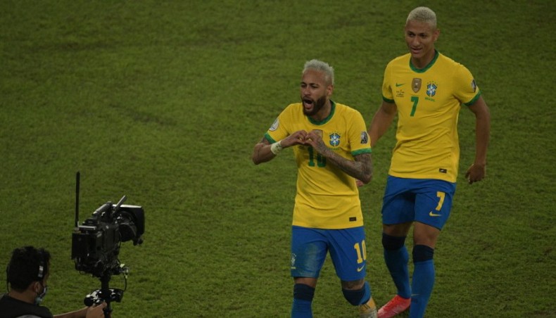 Brazil forward Neymar (L) celebrates with team-mate Richarlison after scoring against Peru during their Copa America 2021 match at the Nilton Santos Stadium in Rio de Janeiro on Thursday. — AFP photo