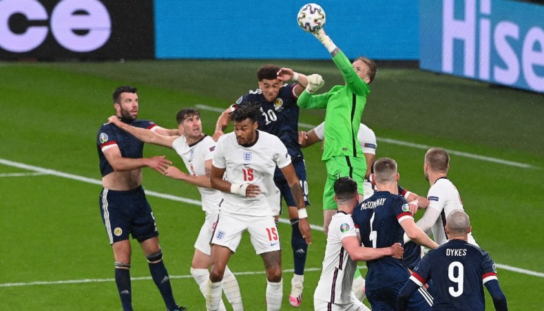 England goalkeeper Jordan Pickford punches the ball away during their Euro 2020 match against Scotland at the Wembley Stadium in London on Friday. — AFP photo