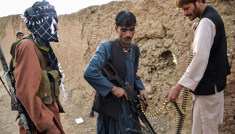 In this photograph taken on March 28, 2021, members of the anti-Taliban ‘Sangorians’ militia take positions during an ongoing fight with Taliban insurgents in the village of Mukhtar, an outpost on the outskirts of Lashkar Gah in Helmand Province. — AFP photo