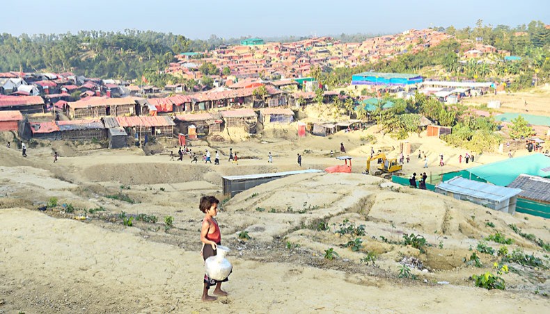 A file photo show a Rohingya child collecting water in Thankhali refugee camp at Ukhia in Cox’s Bazar in November 2017. — Agence France-Presse/Munir uz Zaman