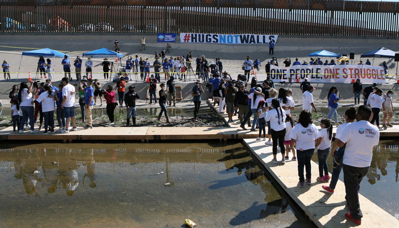 Migrants embrace with their families in the event ‘Hugs, No Walls’, origanized by the US organisation Border Network for Human Rights in the middle of the Rio Grande, on the border between El Paso, Texas state, United States and Ciudad Juarez, Chihuahua state, Mexico, on June 19, 2021. — AFP photo
