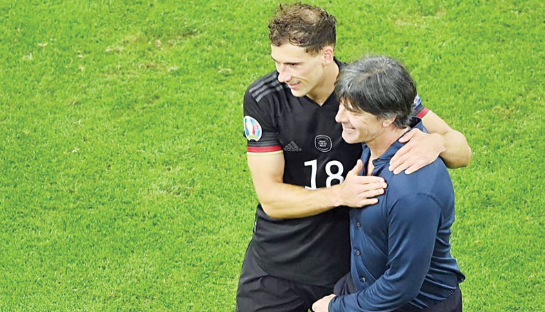 Germany coach Joachim Low (R) and midfielder Leon Goretzka celebrate at the end of their Euro 2020 match against Hungary at the Allianz Arena in Munich on Wednesday. — AFP photo