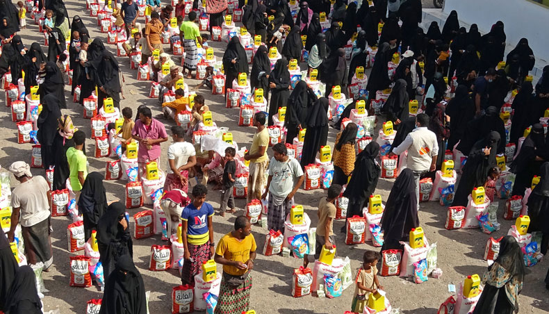 People displaced by conflict receive food aid in the Tuhayta district of Yemen’s war-ravaged western province of Hodeida, on June 30, 2021. — AFP photo
