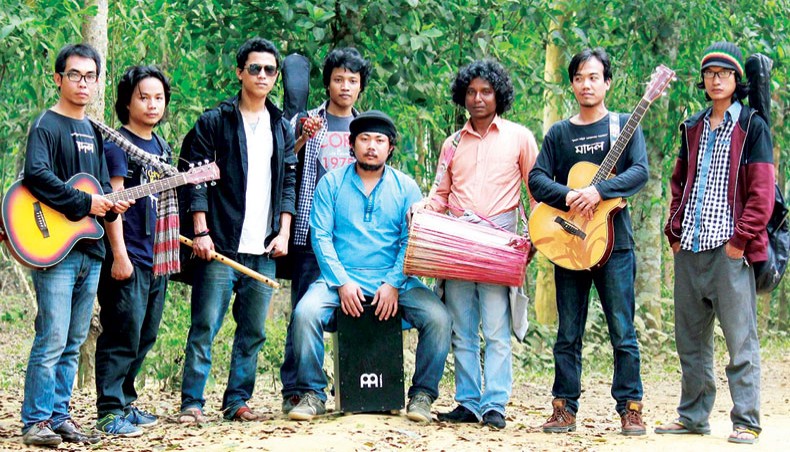 Sham Sagor Mankin, fourth from left, along with members of Madal poses for a photo.
