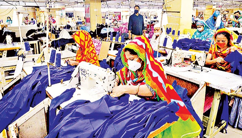 A file photo shows labourers wearing facemasks working at a garment factory in Dhaka. — AFP photo