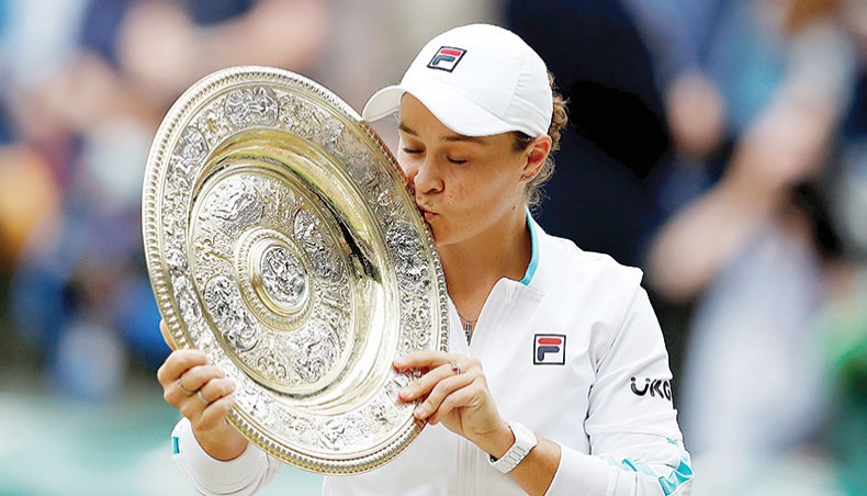 Australia’s Ashleigh Barty kisses the Venus Rosewater Dish trophy after defeating Czech Republic’s Karolina Pliskova in the women’s singles final of the 2021 Wimbledon Championships in London on Saturday. — AFP photo