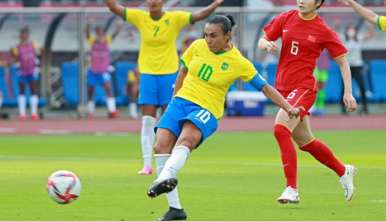 Brazil midfielder Marta shoots to score the opening goal during their Tokyo 2020 Olympic Games women's group F first round match against at the Miyagi Stadium in Miyagi on Wednesday. — AFP photo